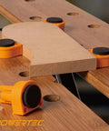 Eight Pack Bench Dogs For Three Quarter Inch Holes With EVA Insert Boss Level Pro Grade Woodworking Stop in use on workbench