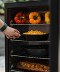 Cooking vegetables and meat in Digital Electric Vertical BBQ Smoker with Patented Side Wood Chip Loader and Chrome Racks