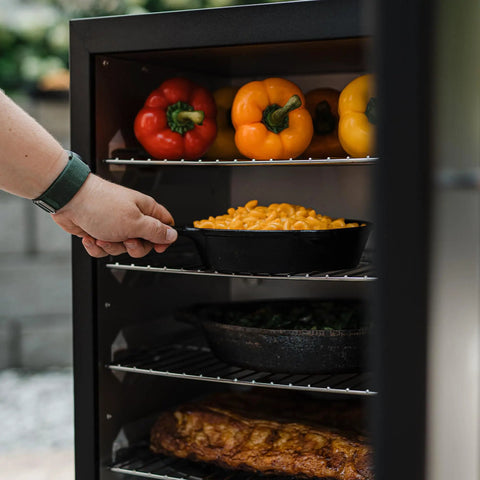 Cooking vegetables and meat in Digital Electric Vertical BBQ Smoker with Patented Side Wood Chip Loader and Chrome Racks