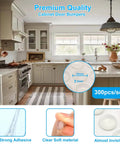 300 Pack Clear Cabinet Bumpers Self Adhesive Rubber Stopper Pads Silent Drawer Cushions For Kitchen Cupboards Stops Door Slamming Butter Smooth Operation, shown in kitchen setting.