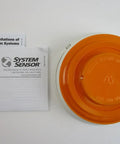 Photoelectric Smoke Detector With Thermal Sensor, Plug In Design, 12 24 VDC, Integrated Sounder And Base next to manual