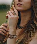 Totally Fire Leather Wrap Bracelet For Women Featuring Super Comfy Braided Leather Straps And Mixed Brown Beads With A Boho Western Layered Cuff Look That Gets Compliments Every Single Day worn by a woman outdoors.