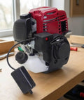 Ready To Mount Gas Powered Replacement Engine For Lawn Mowers And Small Machinery With Hassle Free Swap And Durable Black Housing on workbench.