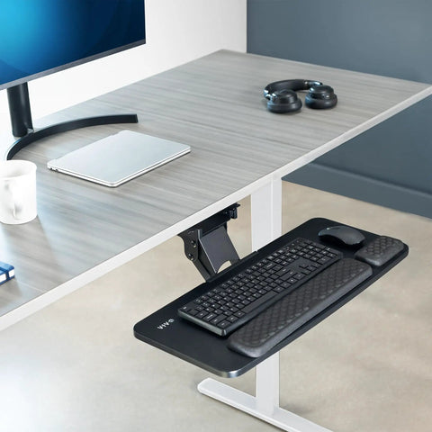 Smooth Gliding Under Desk Keyboard And Mouse Tray With Plush Foam Padding For Home Office Ergonomic Workstation Setup adjustable height shown under a desk.