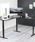 VIVO Electric L Shaped Standing Desk Frame With Height Adjustment For Corner Corner Corner Setup Dual Motors Sturdy Ergonomic Sit Stand Workstation Black Base with monitor and accessories.