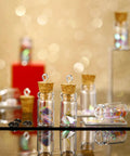 Totally Sweet Mini Glass Bottles With Cork Stoppers And Eye Screws Hella Practical Funnel Kit For Diy Crafts Perfume Sampling Raffle Prizes And Creative Hobby Builds 50 Piece 0.5Ml Pack with cork stoppers and colorful contents.