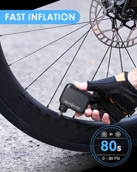 Pocket Sized Electric Bike Pump With 100 PSI inflating road bike tire, handheld, Presta/Schrader valve compatible.