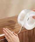 Straight Up Protection Ninja Soft Clear Edge Corner Protectors Baby Proofing Strips 13 foot roll being applied on table edge.