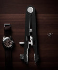 Metal Watch Band Removal Tool Kit with 8 Pins and Spring Bar Tool on wood surface