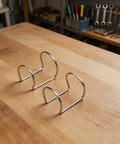 Solid 24 Piece Plasma Cutter Consumables Kit That Totally Slays SG 55 AG 60 Cut 50 And More For Long Lasting Cuts You'll Love, showing two metal holders on wood.