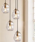 Dope Clear Art Glass Pendant Lights 2 Pack For Kitchen Island And Dining Room Table Modern Organic Globe Ceiling Fixture with sleek brass gold hardware hanging.