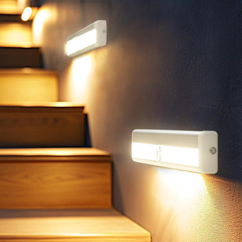 Under Cabinet Lights 10 LED Battery Powered Motion Sensor Closet Lights illuminating stairway, magnetic design for indoor use.