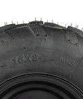 Close-up of a 16x8-7 ATV wheel, heavy-duty build, showing tread pattern for off-road use with tubeless rim and durable construction.