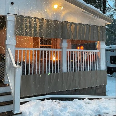 Kickass Clear PVC Tarp Curtains With A Seamless Zipper Door And Heavy Gauge Grommets create shelter on a snowy porch.
