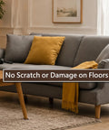 Gray sofa with yellow cushion on a rug, highlighting furniture on non-slip pads to protect hardwood floors from scratches.