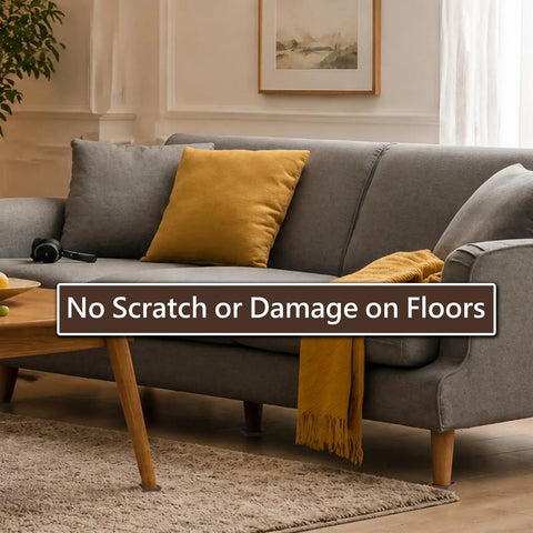Gray sofa with yellow cushion on a rug, highlighting furniture on non-slip pads to protect hardwood floors from scratches.