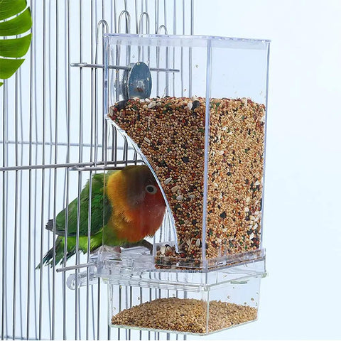 No Mess Premium Clear Acrylic Bird Cage Feeder Two Pack Featuring Sturdy Perch And Spill Proof Seed Hopper A True Zero Hassle Setup For Lovebirds And Finches with a lovebird accessing seeds.