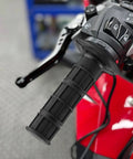 Close-up of 2 Pcs Universal Seven Eighths Inch Motorcycle Grips Soft Rubber Hand Grips For ATV Dirt Bike Polaris Thumb Throttle Motocross And ATV Accessories With Non Slip Checkered Texture For Maximum Control And Comfort On Your Ride partially installed on handlebar
