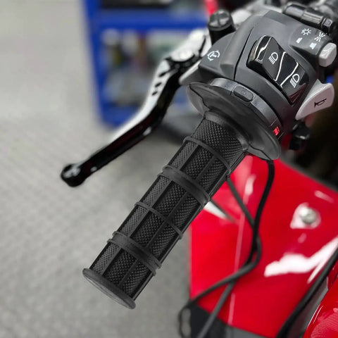 Close-up of 2 Pcs Universal Seven Eighths Inch Motorcycle Grips Soft Rubber Hand Grips For ATV Dirt Bike Polaris Thumb Throttle Motocross And ATV Accessories With Non Slip Checkered Texture For Maximum Control And Comfort On Your Ride partially installed on handlebar