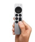 Hand holding Siri Remote Third Gen For 4K TV Box With Sleek Touch Clickpad Outer Ring Navigation Precise Control Fast App Access Voice Control.