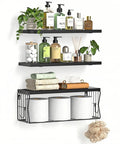 Heavy Duty Floating Bathroom Shelves Wall Mounted Set Of Three With Slick Black Finish For Over Toilet Storage showing toiletries and towels.