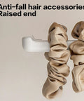 Suction Cup Headband Holder And Wall Mounted Hair Accessory Organizer Keeps Your Bathroom Vanity Looking Fly With This Hassle Free No Drill Scrunchie Storage Rack In Crisp White showing raised end with scrunchies.