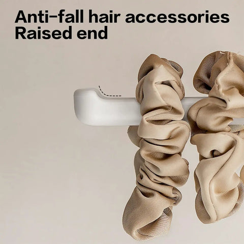 Suction Cup Headband Holder And Wall Mounted Hair Accessory Organizer Keeps Your Bathroom Vanity Looking Fly With This Hassle Free No Drill Scrunchie Storage Rack In Crisp White showing raised end with scrunchies.
