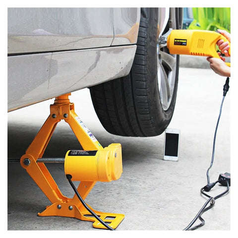 No Sweat Electric Trailer Jack With Wireless Remote, Portable 2.5 Ton Car Lifter in use under vehicle for tire change.