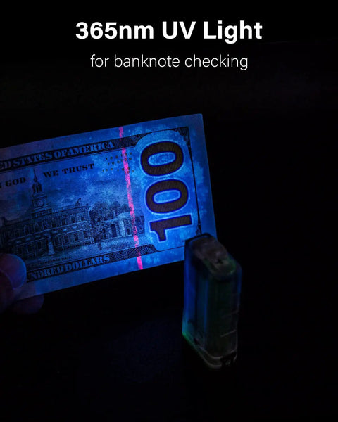 Angel Eyes E8 Keychain Flashlight 700 Lumens USB C Rechargeable showing 365nm UV light on banknote in dark