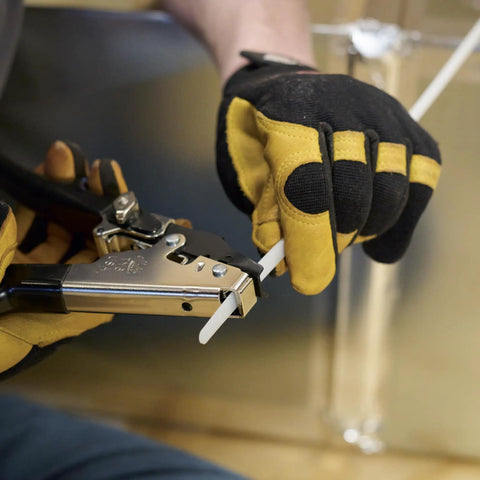 Person using HVAC Flex Duct Cable Tie Tensioning Tool With Auto Cut Off And Adjustable Tension Knob on nylon tie.