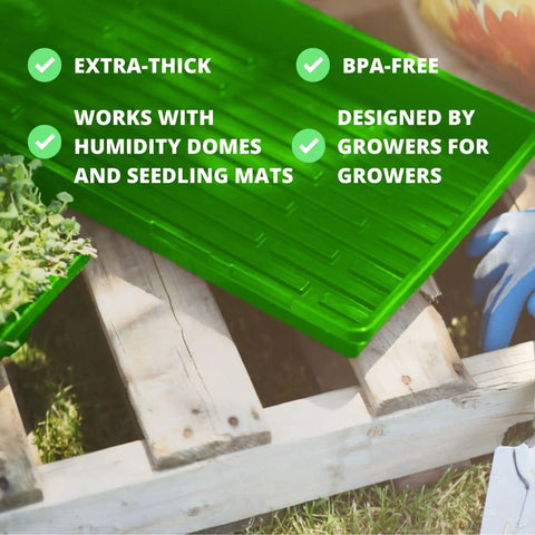 Close-up of a green Beast Mode Durable Seed Starting Tray with text highlights on features like BPA-free and extra-thick design, on wooden pallet.
