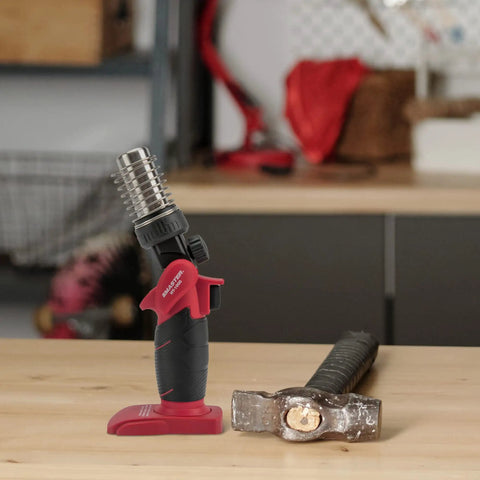 Cordless Butane Heat Gun With Shrink Reflector for heat shrink tubing; portable tool on a workbench, no cords