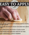 Applying Danish Oil Wood Finish Quart Pure Polymerized Linseed Oil For Furniture Rustic Pieces And Prime Wood with a cloth on a surface