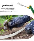 Gardener using heavy duty trowel from Versatile Garden Shovel And Pickaxe Set For Digging And Planting With Ergonomic Handle.