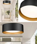 Two Light Frosted Glass Flush Mount Ceiling Light in black with gold inner accent in modern entryway setting