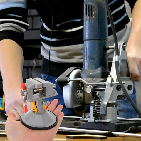 Rotating Small Bench Vise With Quick Release Clamp for Woodworking and Metalworking, portable size in hand, industrial background
