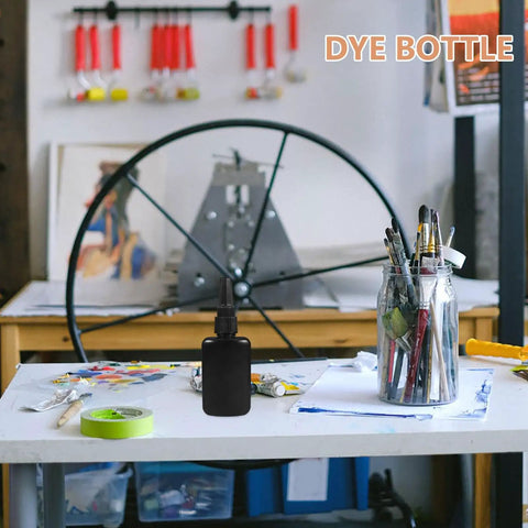 Phenofice Black Glue Dispensing Bottles 50 Ml Hdpe Precision Nozzle Set on a craft table with art supplies.