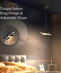 Straight Fire Vibe For Your Home Decor Featuring Fresh Saturn Ring Pendant Light With Remote Dimming And Sleek Black Overhead Ceiling Fixture For Kitchen Or Dining Room, showcasing adjustable 330° design.