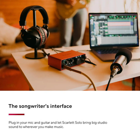 Scarlett Solo 4th Gen USB Audio Interface Bundle with mic, headphones, and laptop on desk in home studio.