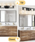Top Shelf 4 Light Bathroom Vanity Light With Clear Glass Sleeves Matte Black Vintage Wall Sconce in up and down positions above a mirror.