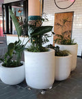 Heavy Duty Plant Caddy On Wheels With 3.0mm Aluminum Alloy Frame Supporting Large Round Pots, Visible On Stone Floor