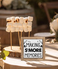 Six Inch Smores Station Sign with toasted marshmallows on wooden platter, outdoor camping decor