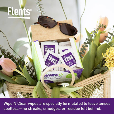 Flents Wipe N Clear lens wipes packets in a green box inside a gift basket with sunglasses