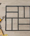 Plastic Path Maker Mold For Concrete Pavers 16.45 Inch shown on wooden floor with tools.