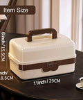Front view of cream and brown three layer plastic tackle box organizer with locking dividers, handle visible.