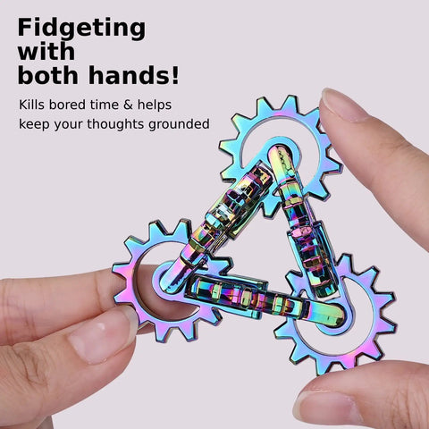 Hand holding Quiet Metal Infinity Gear Fidget Toy For Focus And Stress Relief with rainbow-plated smooth gear movement