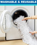 Person placing a washable mop pad into a washing machine for cleaning, emphasizing the reusable feature.
