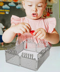Child playing with Slick Light Gray Plastic Miniature Fence Kit With Dead Simple Snap Together Design For Farm Diorama And Prison Model Builds.