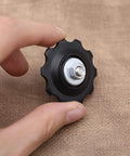 Hand holding 4X 10T Bicycle Gear Mech Pulley Jockey Wheel Kit Universal For 5,6,7,8 Speed Derailleur With Dust Cover, Bolt