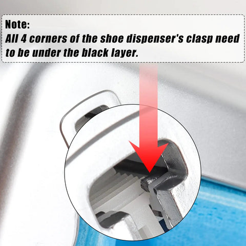 Close-up of Automatic Shoe Covers Dispenser clasp showing instruction to secure corners under black layer for secure fit.